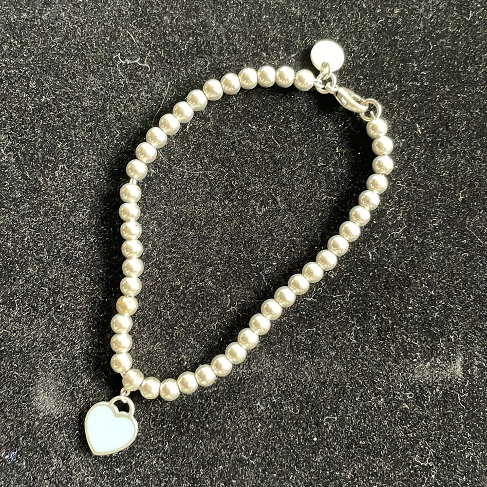 Tiffany & Co. sterling silver “mini heart and bead bracelet” (blue heart charm)